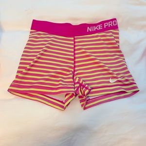 Pink and yellow stripped Nike spandex shorts